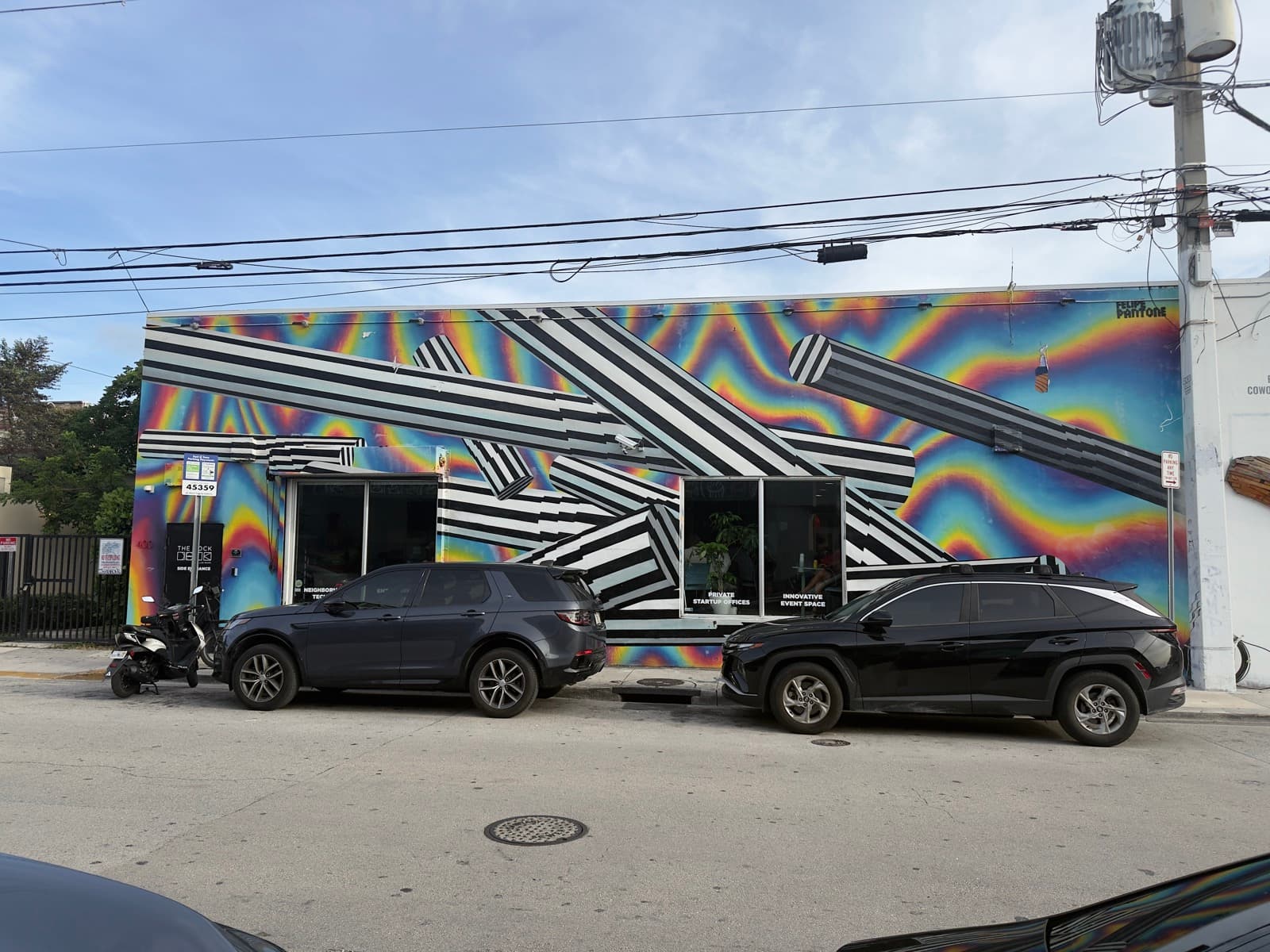 A Wynwood mural of stacked Pantone-style color chips painted across a garage door.